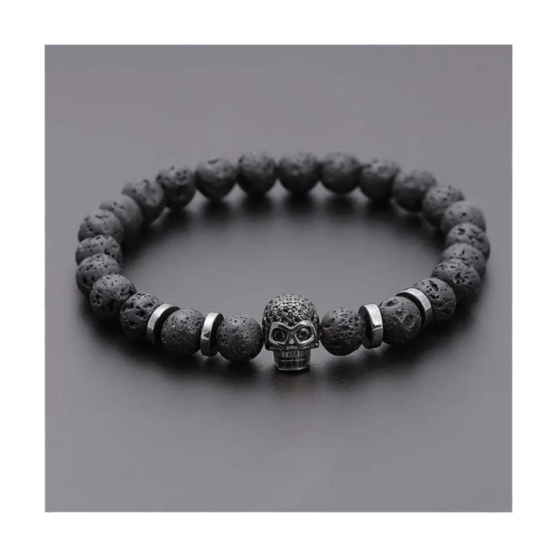 Bracelet pirate tête de mort en métal sombre avec pierres noires et métal argenté Trésors de Pirate